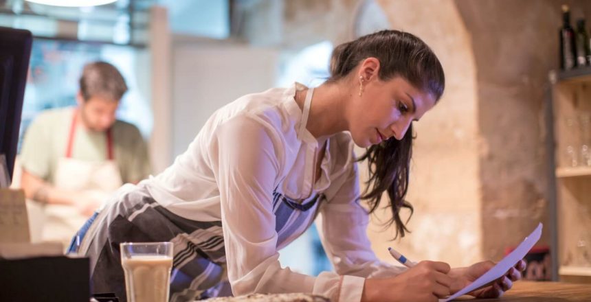 Restaurant owners working in kitchen